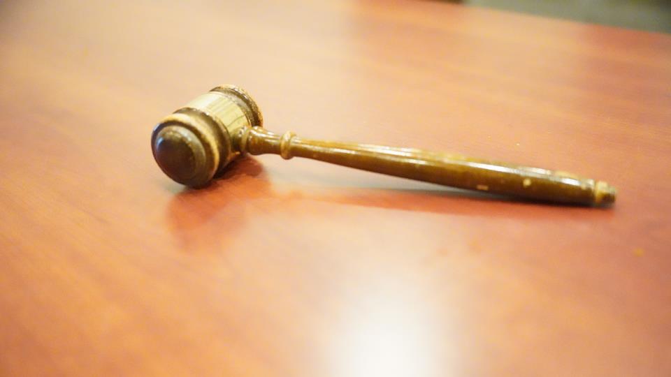 gavel laying on wooden table