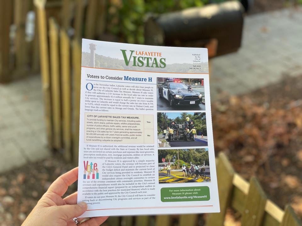 Photo of hand holding out 2024 Fall issue of Vistas